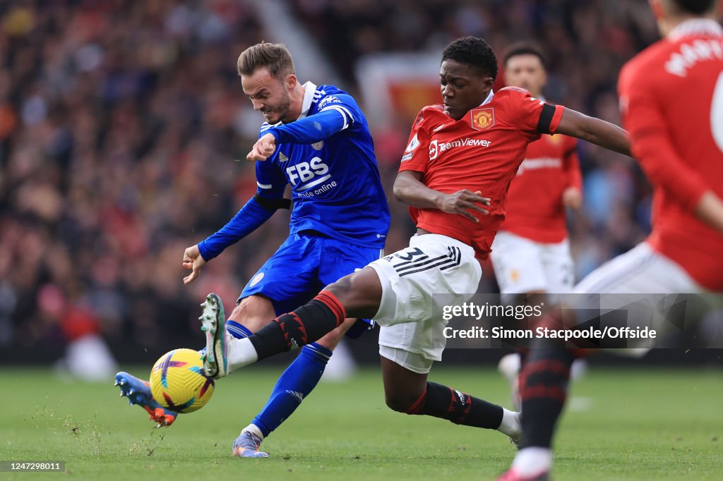 Mainoo Shot Kobbie Mainoo of Manchester United blocks a shot from James Maddison ...