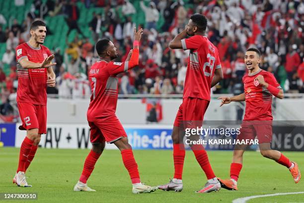 Duhail's forward Mohammed Muntari celebrates scoring with his teammates during the AFC Champions League round of 16 match between Qatar's Al-Rayyan...
