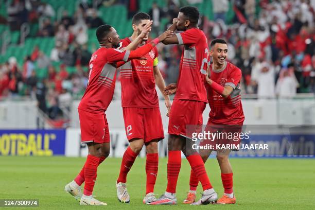 Duhail's forward Mohammed Muntari celebrates scoring with his teammates during the AFC Champions League round of 16 match between Qatar's Al-Rayyan...