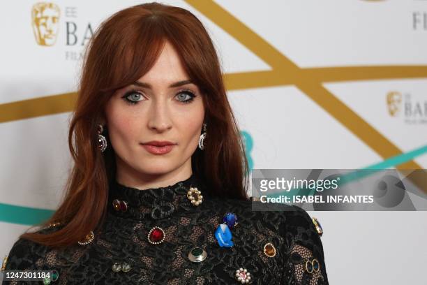 British actress Sophie Turner poses on the red carpet upon arrival at the BAFTA British Academy Film Awards at the Royal Festival Hall, Southbank...