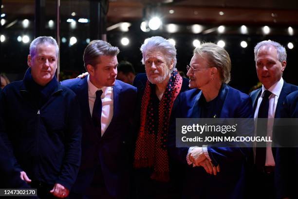 Actor Matt Damon , Irish singer Bono , Irish musician Adam Clayton and US screenwriter Bill S. Carter pose during a photo call prior to the premiere...