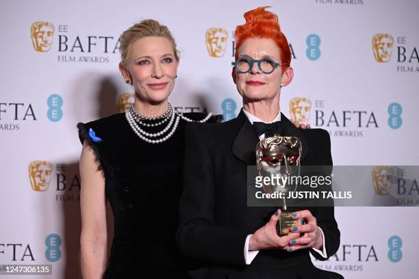 Australian actress Cate Blanchett poses with Fellowship Award winning costume designer Sandy Powell , with her award in the winner's room at the...