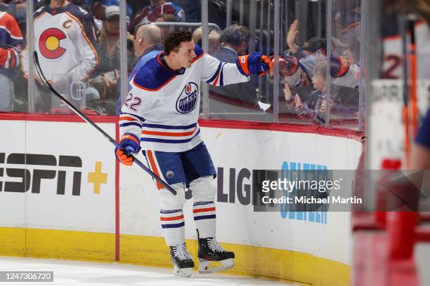 Tyson Barrie of the Edmonton Oilers engages with fans prior to the game against the Colorado Avalanche at Ball Arena on February 19, 2023 in Denver,...