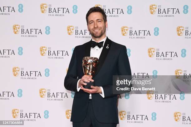 Paul Rogers, winner of the Editing Award for 'Everything Everywhere All At Once", poses in the Winners Room at the EE BAFTA Film Awards 2023 at The...