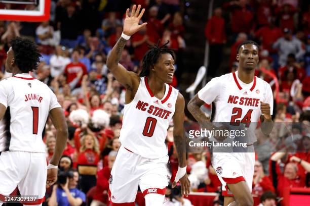 Terquavion Smith of the NC State Wolfpack reacts near the end of their game against the North Carolina Tar Heels at PNC Arena on February 19, 2023 in...
