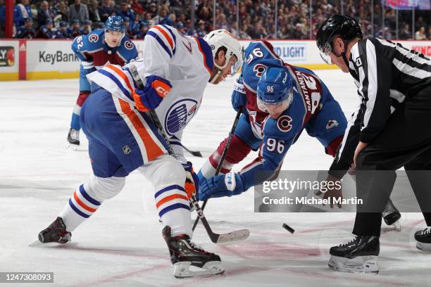 Connor McDavid of the Edmonton Oilers faces off against Mikko Rantanen of the Colorado Avalanche at Ball Arena on February 19, 2023 in Denver,...