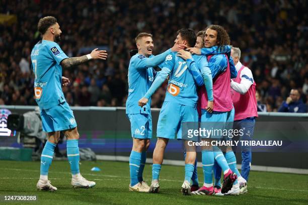 Marseille's Turkish forward Cengiz Under celebrates scoring his team's second goal during the French L1 football match between Toulouse FC and...