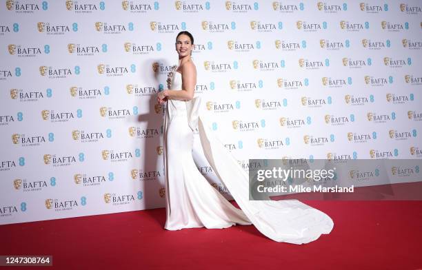 Lily James poses in the Winners Room at EE BAFTA Film Awards 2023 at The Royal Festival Hall on February 19, 2023 in London, England.