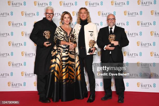 Jason Baird, Louise Coulston, Shane Thomas and Mark Coulier, winners of the Make Up and Hair Award for 'Elvis', pose in the Winners Room at the EE...