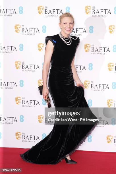 Cate Blanchett arrives into the press room with the award for Leading Actress for Tar at the 76th British Academy Film Awards held at the Southbank...