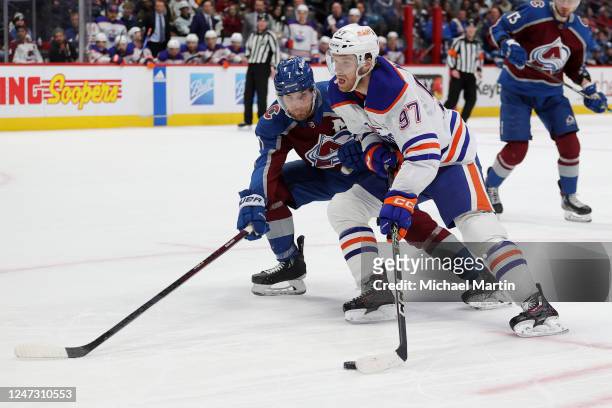 Connor McDavid of the Edmonton Oilers skates against Devon Toews of the Colorado Avalanche at Ball Arena on February 19, 2023 in Denver, Colorado.