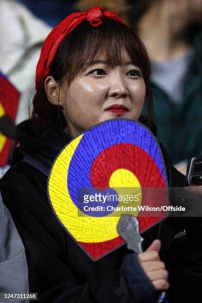 Korea fan with a decorative hand fan during the Arnold Clark Cup match between England and Italy at CBS Arena on February 19, 2023 in Coventry,...