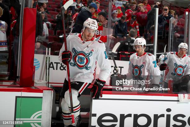 Taylor Raddysh of the Chicago Blackhawks wears a warm-up jersey in honor of first responders prior to the game against the Toronto Maple Leafs at...