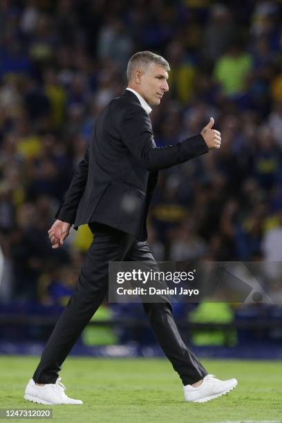 Martin Palermo, coach of Platense, gives a thumb up to fans as he leaves the field at the end of the first half during a match between Boca Juniors...