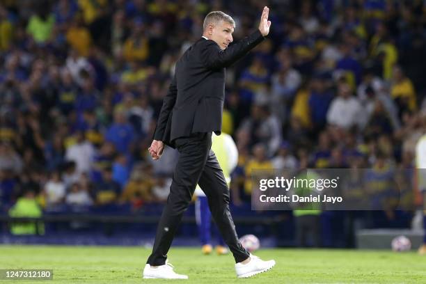 Martin Palermo, coach of Platense, waves to fans as he leaves the field at the end of the first half during a match between Boca Juniors and Platense...