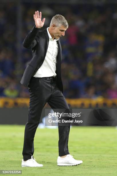 Martin Palermo, coach of Platense, waves to fans as he leaves the field at the end of the first half during a match between Boca Juniors and Platense...