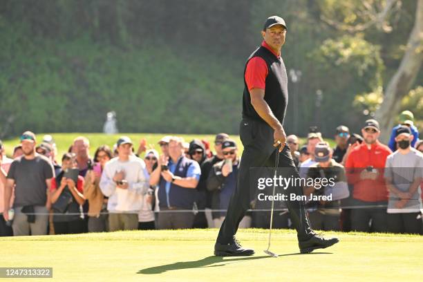 Tiger Woods reads the 16th green during the final round of The Genesis Invitational at Riviera Country Club on February 19, 2023 in Pacific...