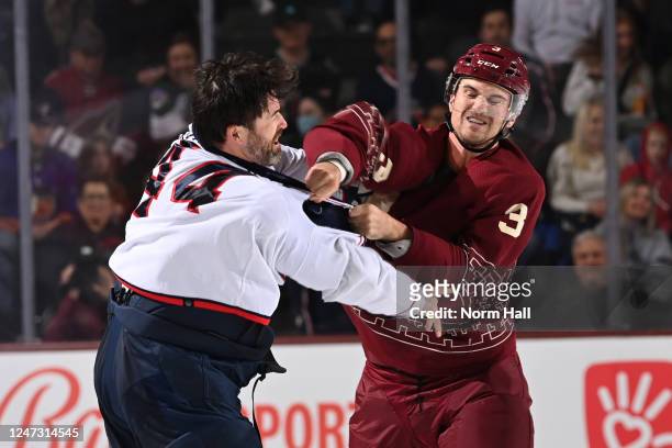 Josh Brown of the Arizona Coyotes punches Erik Gudbranson of the Columbus Blue Jackets in a fight during the second period at Mullett Arena on...