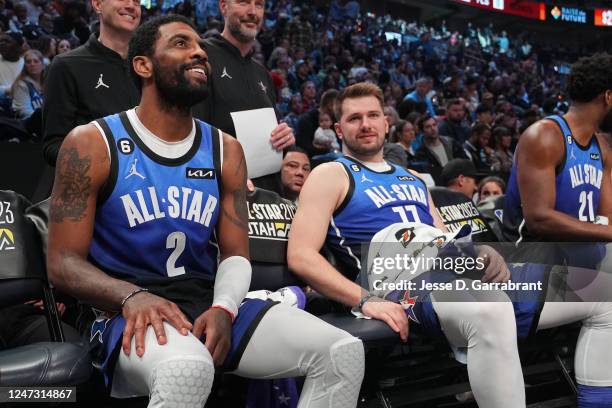 Kyrie Irving and Luka Doncic of Team LeBron smile on the bench during the NBA All-Star Game as part of 2023 NBA All Star Weekend on Sunday, February...