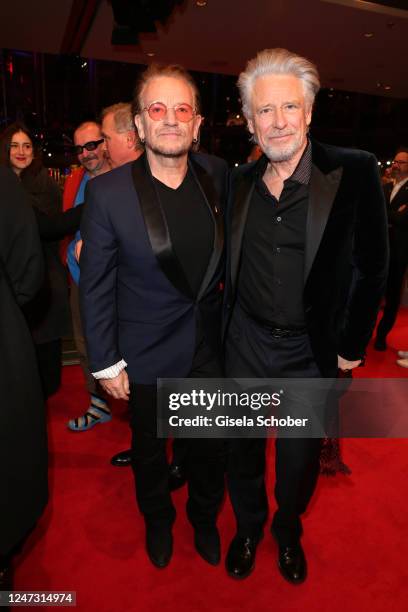 Singer and frontman Bono and Adam Clayton as guest for kiss the future at the "Ingeborg Bachmann - Reise in die Wueste" premiere during the 73rd...