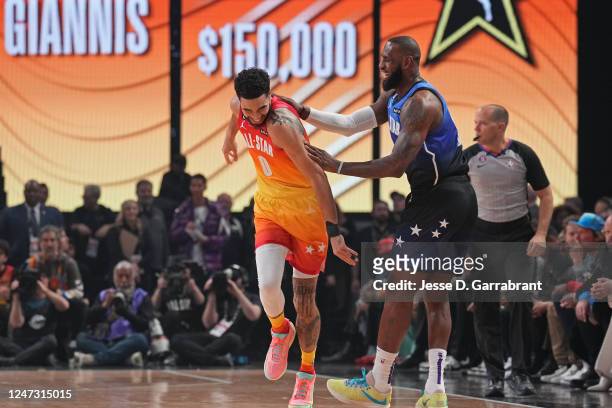 Jayson Tatum of Team LeBron and LeBron James of Team LeBron smile during the NBA All-Star Game as part of 2023 NBA All Star Weekend on Sunday,...