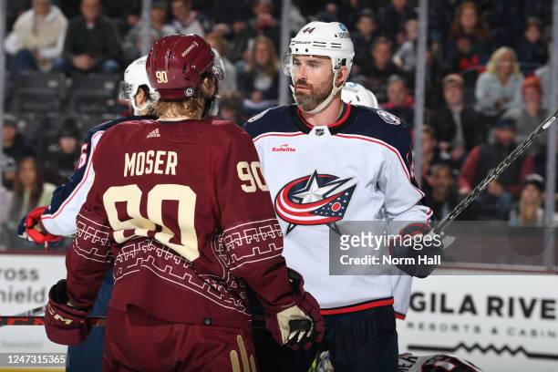 Moser of the Arizona Coyotes and Erik Gudbranson of the Columbus Blue Jackets get into an altercation during the third period at Mullett Arena on...