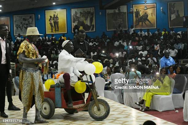 South Sudanese comedian David Lodiong imitates Pope Francis during his performance, at the Kilkilu Ana Comedy Show in Juba on February 9, 2023. -...