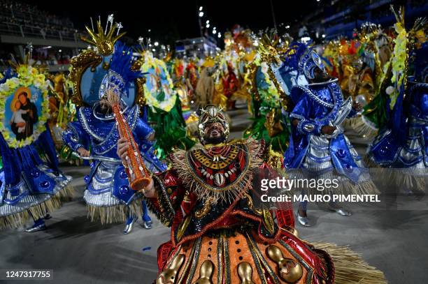 Members of the Unidos da Tijuca samba school perform during the first night of Rio's Carnival parade at the Sambadrome Marques de Sapucai in Rio de...