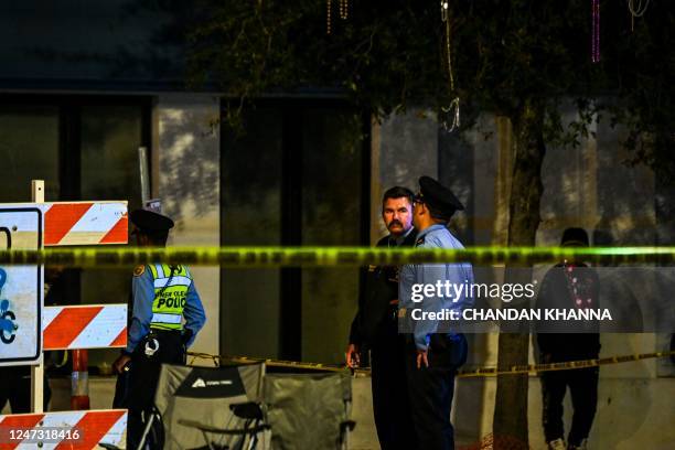 Police officers collect evidence at the scene of a shooting that occured during the Krewe of Bacchus parade in New Orleans, February 19, 2023. - New...