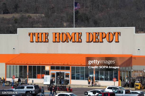 Customers are seen in the parking lot of a Home Depot store in Bloomsburg.