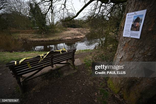 Daffodils and yellow ribbons are pictured on the bench that missing person Nicola 'Nikki' Bulley's phone was found on in January when she was last...