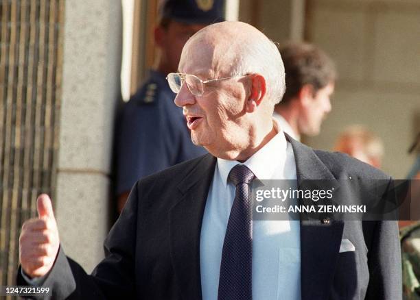 Former apartheid-era State President P W Botha gives the thumbs-up as he leaves the Magistrate's Court in George 15 April, the first day of his trial...