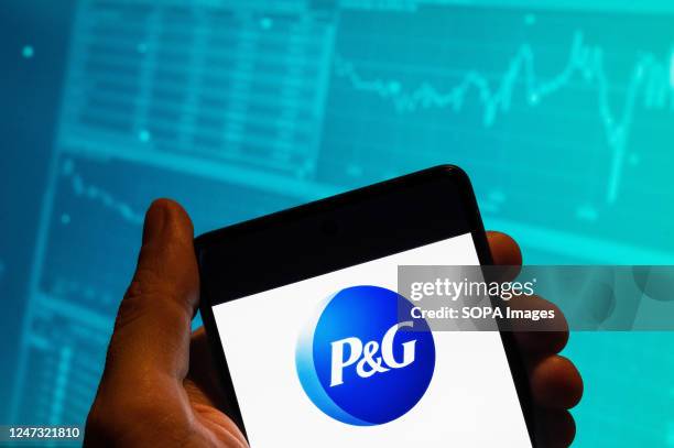 In this photo illustration, the American multinational consumer goods company Procter & Gamble logo is seen displayed on a smartphone with an...