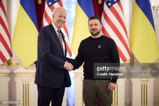 In this handout photo issued by the Ukrainian Presidential Press Office, U.S. President Joe Biden meets with Ukrainian President Volodymyr Zelensky...