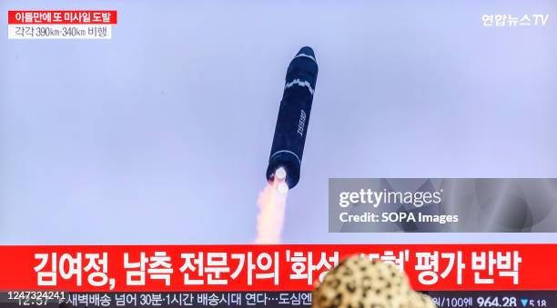 Tv screen shows a file image of North Korea's missile launch during a news program at the Seoul Railway Station in Seoul. North Korea fired two...