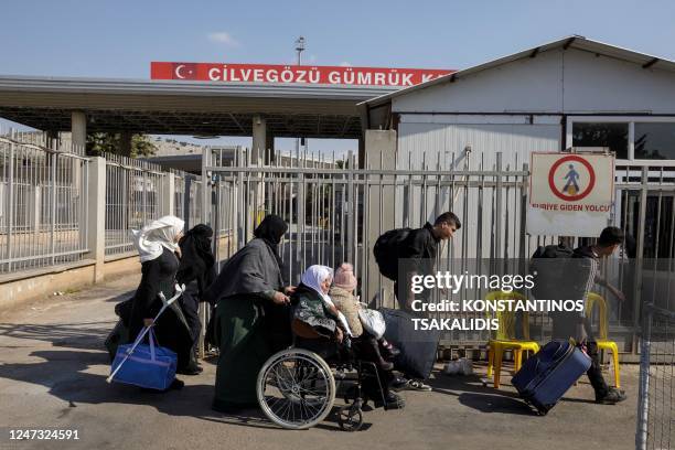 Syrian refugees living in the earthquake-affected areas of southeastern Turkey cross the Turkey-Syria border at the Cilvegozu border crossing,...