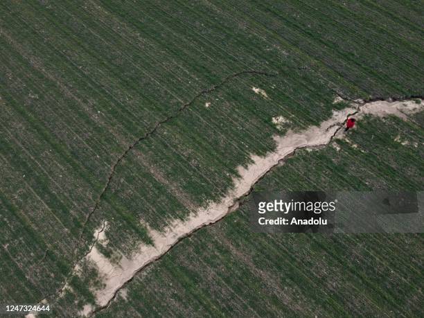 An aerial view of fault line cracks on a land in Ordekdere Neighborhood after the powerful twin earthquakes hit Kahramanmaras, Turkiye on February...