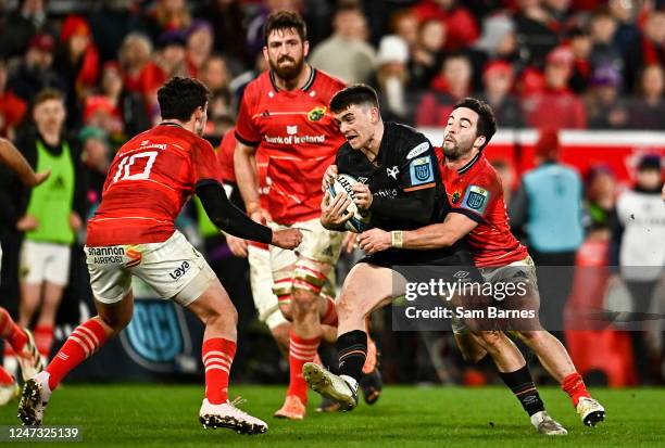 Limerick , Ireland - 17 February 2023; Reuben Morgan-Williams of Ospreys is tackled by Paddy Patterson, right, and Joey Carbery of Munster during the...