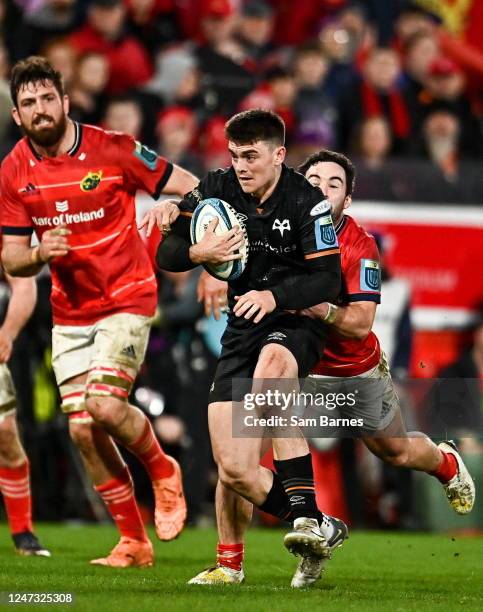 Limerick , Ireland - 17 February 2023; Reuben Morgan-Williams of Ospreys is tackled by Paddy Patterson of Munster during the United Rugby...