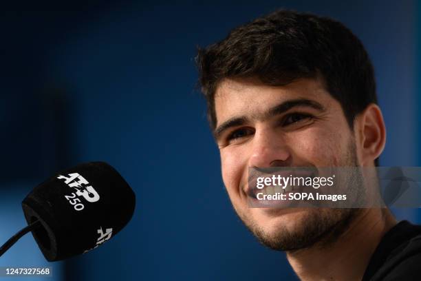 Carlos Alcaraz of Spain smiles during a press conference after winning the Men's Singles Final against Cameron Norrie of Great Britain during day...