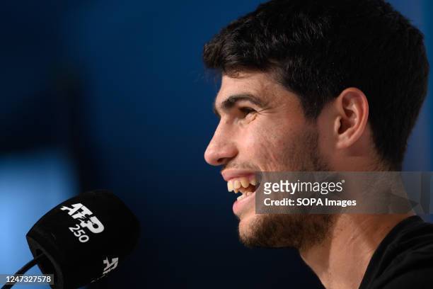Carlos Alcaraz of Spain smiles during a press conference after winning the Men's Singles Final against Cameron Norrie of Great Britain during day...