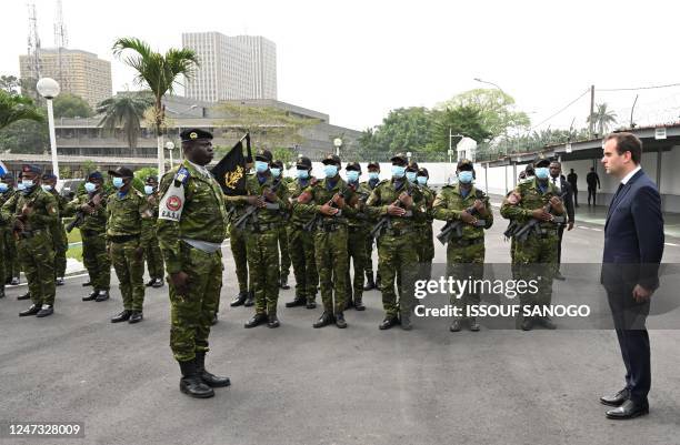 French Army Minister Sebastien Lecornu prepares to inspect a guard of honour upon his arrival at the Ivorian Ministry of Defence in Abidjan on...