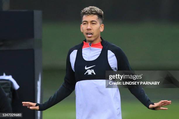 Liverpool's Brazilian striker Roberto Firmino gestures during a team training session at the AXA Training Centre in Liverpool, north-west England on...