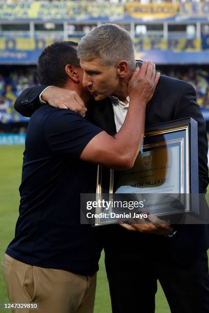 Martin Palermo, coach of Platense, and former Boca Juniors' players, greets football council member of Boca Juniors, Marcelo Delgado, before a match...