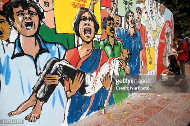 Artists paint on a wall at the central Shaheed Minar area ahead of the International Mother Language Day, in Dhaka, Bangladesh, on February 20, 2023.