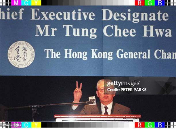 Hong Kong SAR chief executive-elect Tung Chee-Hwa gestures to guests at a Hong Kong Chamber of Commerce luncheon in his first major public address as...