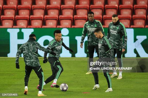 Real Madrid's Brazilian defender Eder Militao and Real Madrid's Belgian midfielder Eden Hazard attend a team training session at Anfield Stadium in...