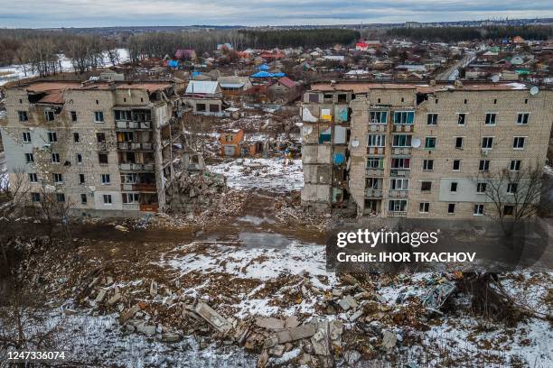 An aerial view shows a residential building damaged by shelling in Izyum, Kharkiv region on February 20 amid the Russian invasion of Ukraine.