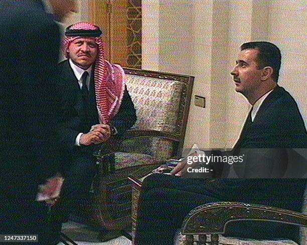 Grab from the official Syrian television station shows Jordan's King Abdullah II meeting with Syrian heir apparent Bashar al-Assad during the funeral...