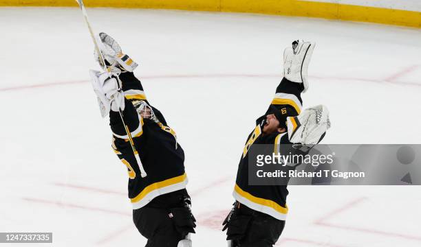 Linus Ullmark of the Boston Bruins celebrates with teammate Jeremy Swayman after a win against the Ottawa Senators at the TD Garden on February 20,...
